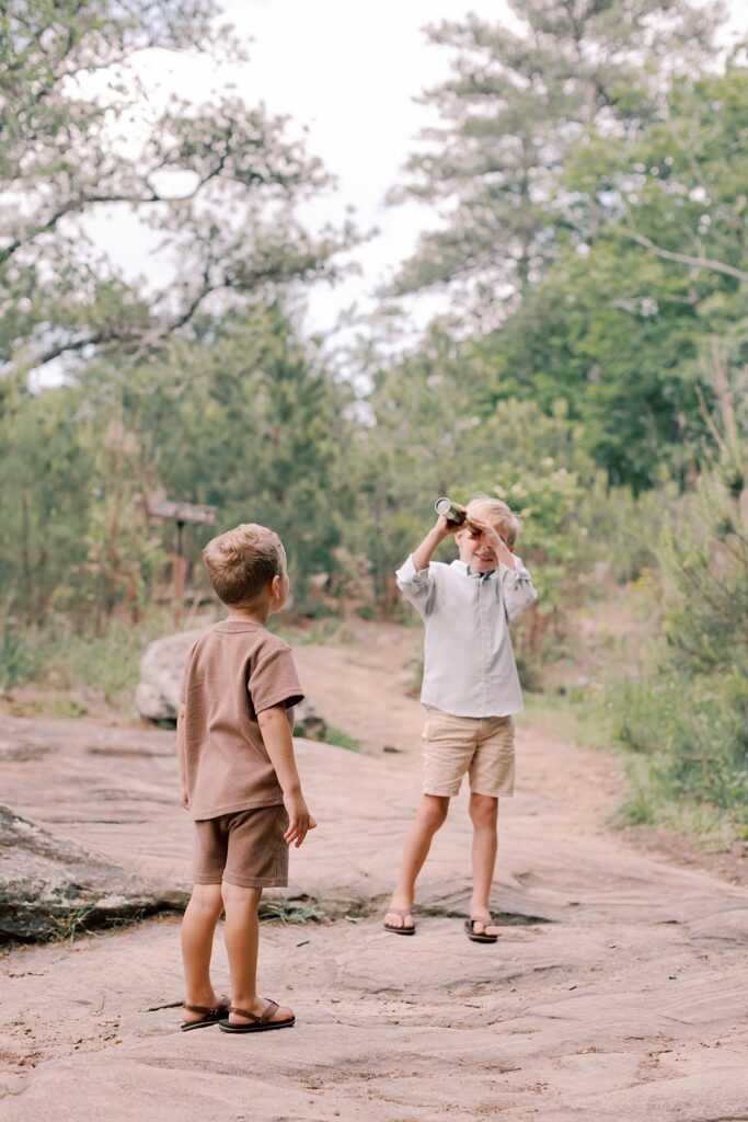 Two young boys exploring wooded path at Pigeon Hill Trailhead