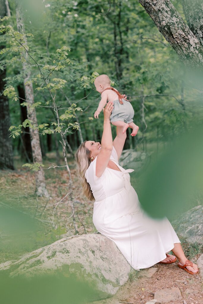 Mom holding baby boy during golden hour family shoot in Georgia