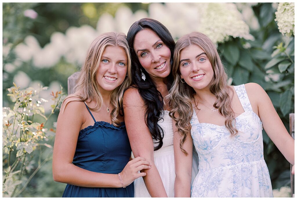 Close-up of mom and daughters laughing